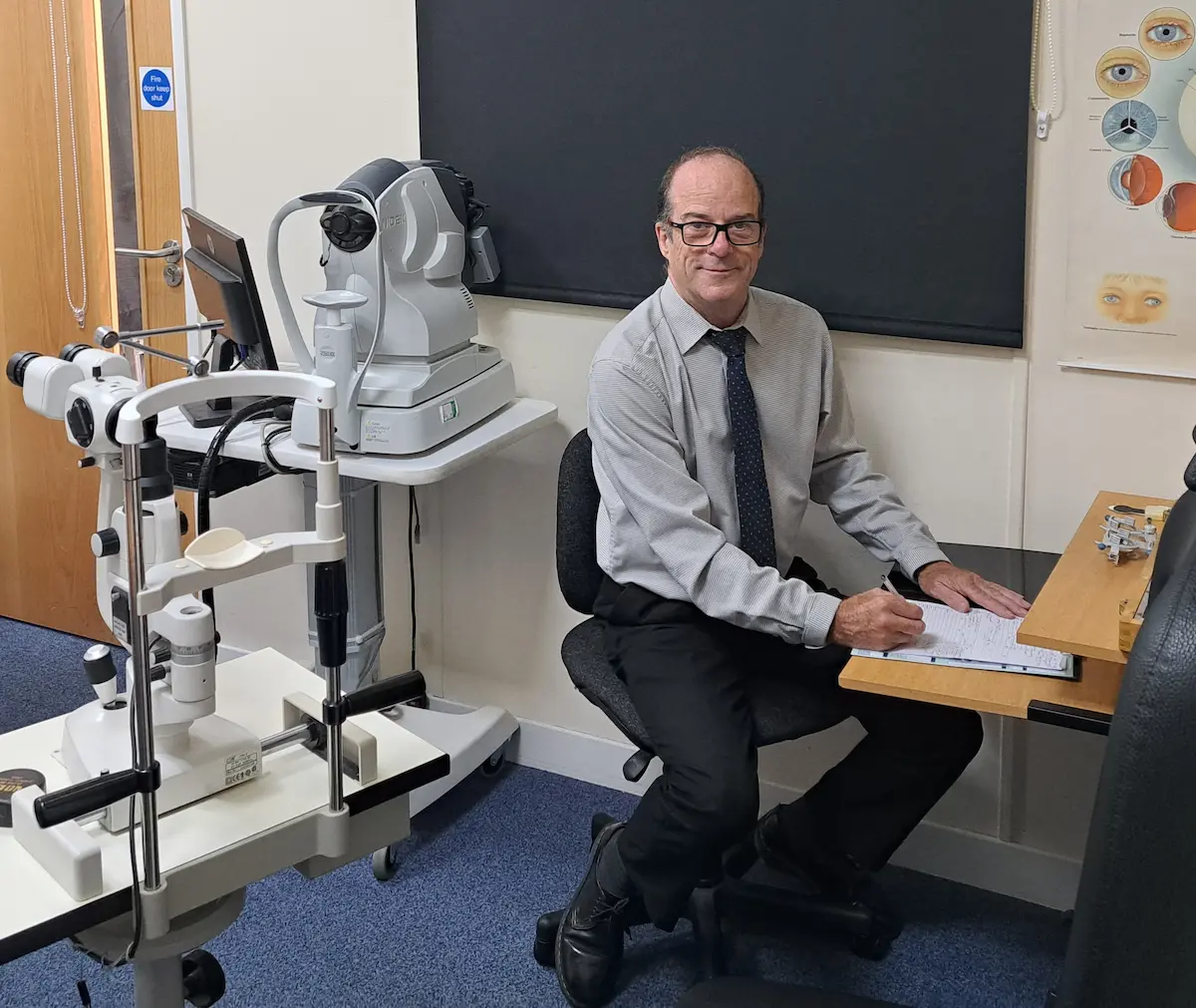 Kieron Johns at the Nidek autorefractor in the test room at Cwmfelin Opticians